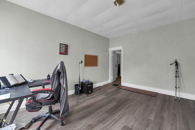 office space with baseboards and wood finished floors