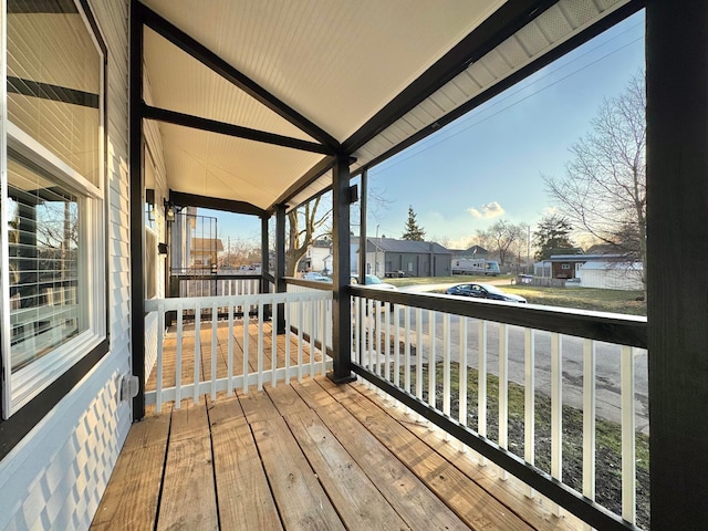 wooden terrace featuring a residential view