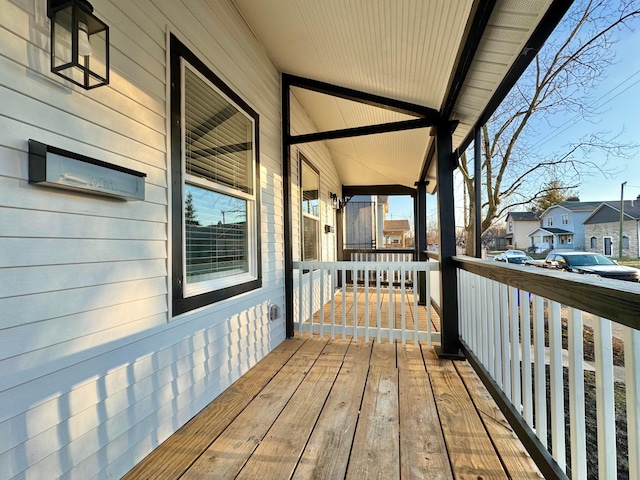 wooden deck featuring a residential view