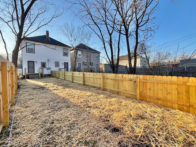 view of yard with a fenced backyard