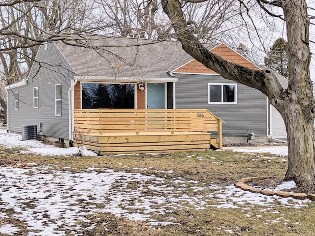 view of front facade featuring a deck and central AC