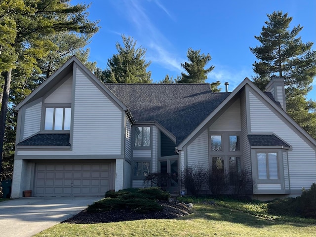 view of front of property featuring a shingled roof, concrete driveway, a chimney, and an attached garage