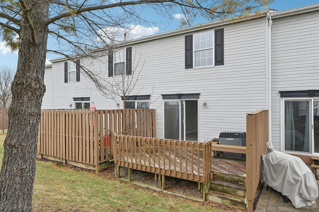 back of house with central AC and a deck