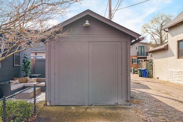 view of shed with fence