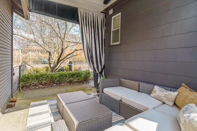 view of patio / terrace featuring fence and an outdoor living space