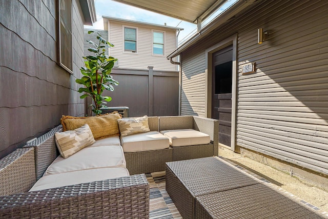 view of patio / terrace with outdoor lounge area and fence