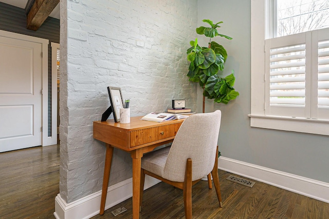 office space featuring beamed ceiling, wood finished floors, visible vents, and baseboards