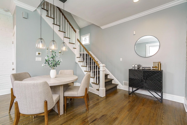 dining area featuring stairway, wood finished floors, and baseboards