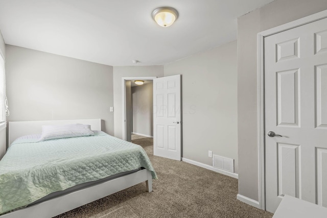 bedroom featuring baseboards, visible vents, and carpet flooring