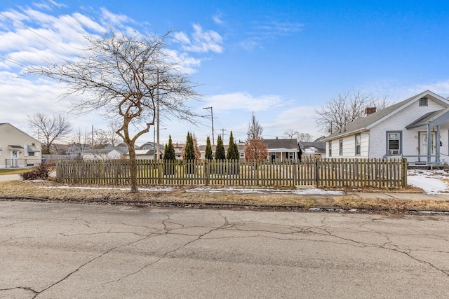 view of yard with a fenced front yard and a residential view