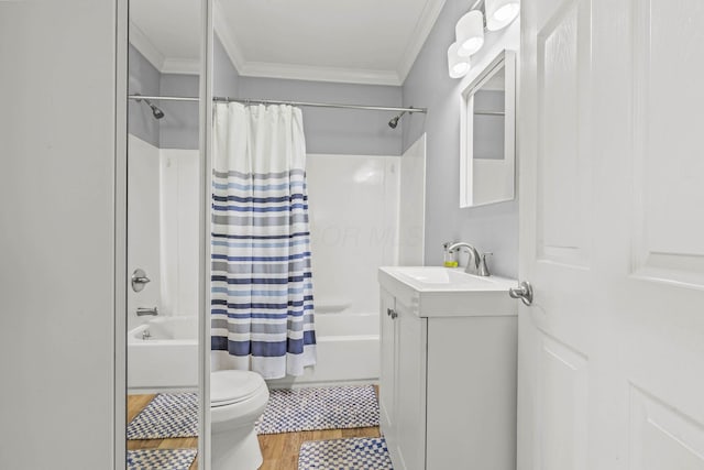 full bathroom featuring shower / bath combo, toilet, wood finished floors, crown molding, and vanity