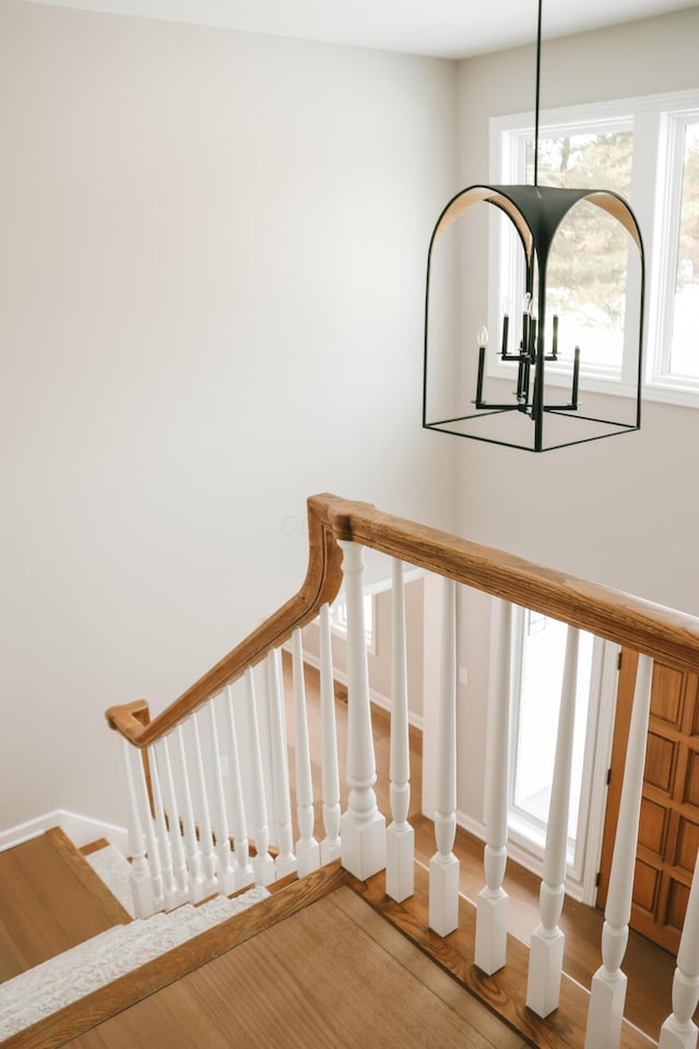 stairs featuring baseboards and wood finished floors