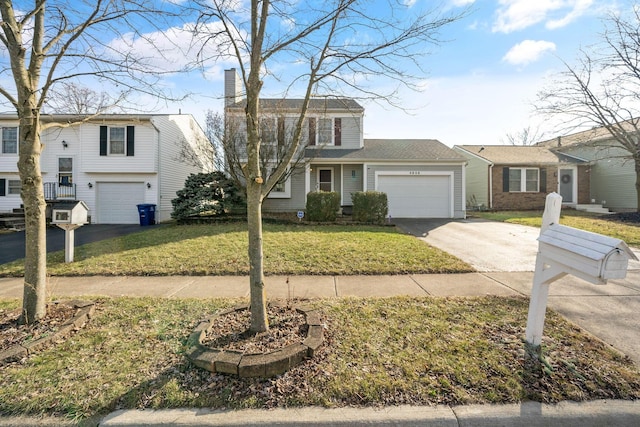 view of front of home featuring driveway, a chimney, and a front lawn