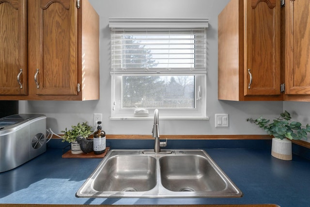 kitchen with brown cabinets and a sink