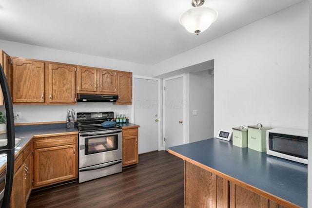 kitchen featuring stainless steel electric range oven, white microwave, brown cabinetry, and under cabinet range hood