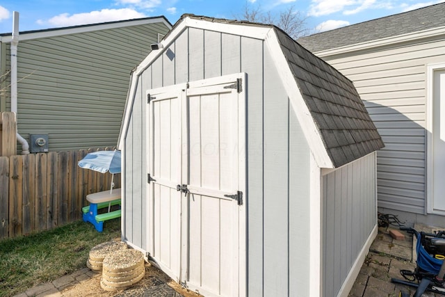 view of shed with fence