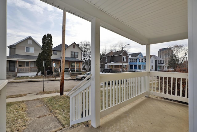 view of patio with a residential view and a porch