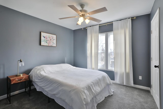 carpeted bedroom featuring a ceiling fan and baseboards