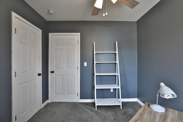 unfurnished bedroom featuring ceiling fan, carpet floors, and baseboards