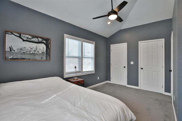 bedroom featuring carpet floors, lofted ceiling, ceiling fan, and baseboards