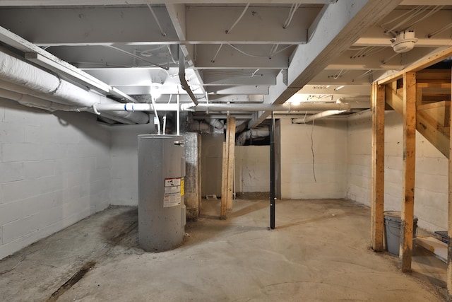 unfinished basement featuring water heater