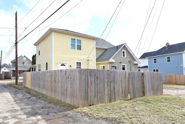 exterior space with a residential view and fence