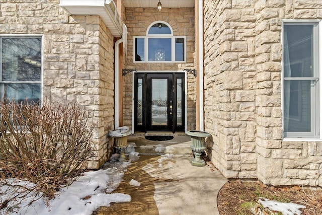 view of exterior entry with stone siding