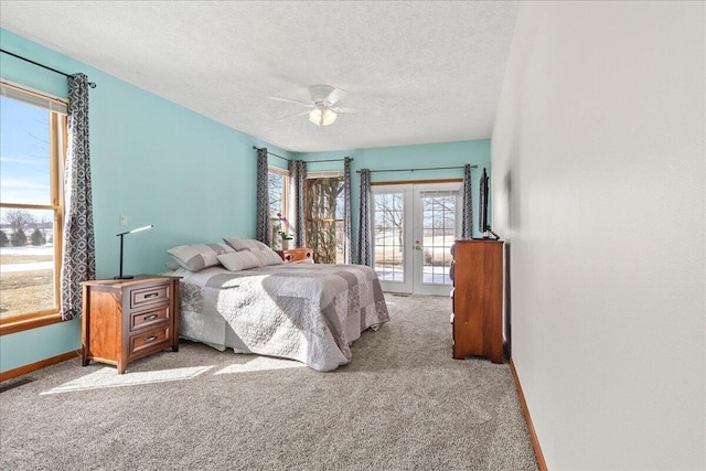 bedroom featuring baseboards, light colored carpet, access to exterior, a textured ceiling, and french doors