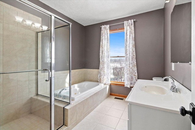 bathroom with visible vents, a stall shower, vanity, tile patterned flooring, and a bath