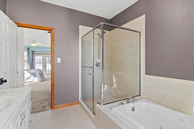 full bath with french doors, a textured ceiling, ensuite bath, a shower stall, and a jetted tub