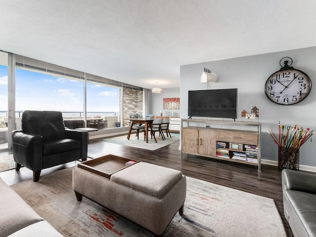 living room with dark wood-style floors and baseboards