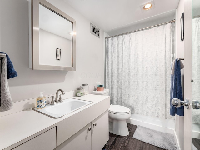 full bathroom with toilet, wood finished floors, vanity, visible vents, and a shower with curtain