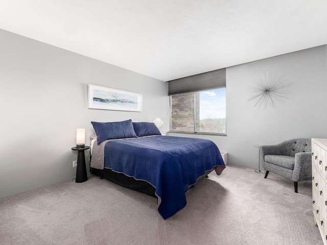 bedroom featuring light carpet