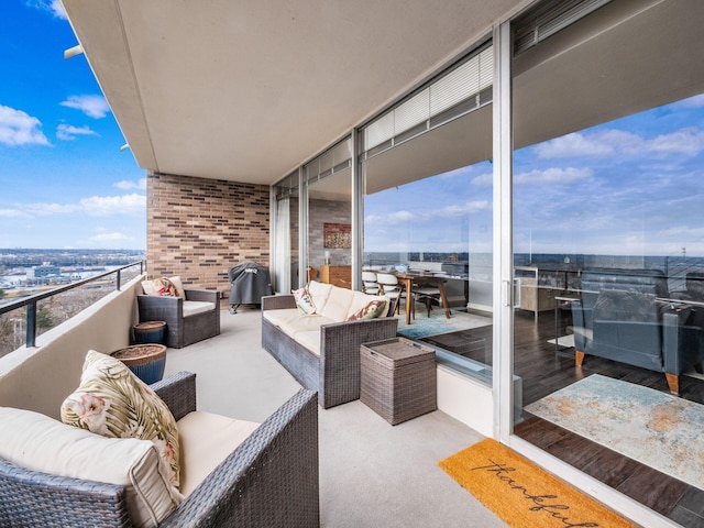 balcony with a sunroom and an outdoor living space