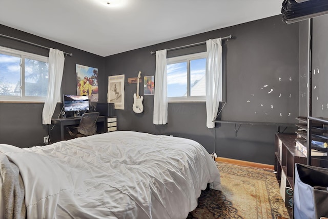 bedroom featuring baseboards