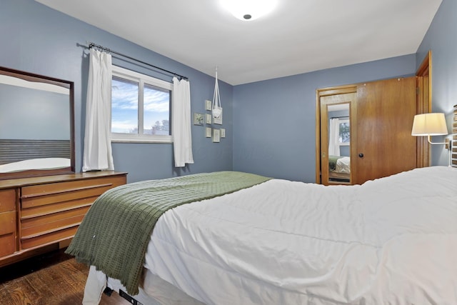 bedroom featuring dark wood-style floors