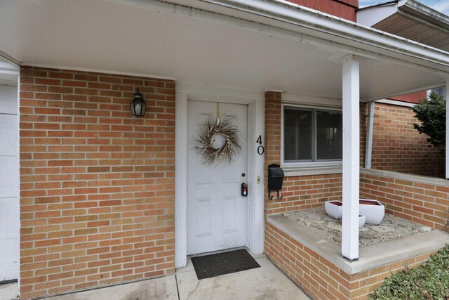 entrance to property with brick siding