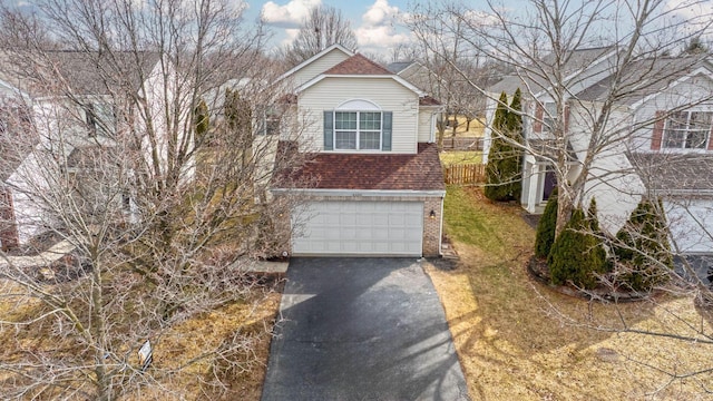 view of front of house with aphalt driveway, brick siding, a shingled roof, and an attached garage