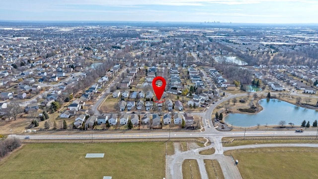 bird's eye view featuring a residential view and a water view