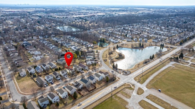 bird's eye view with a water view and a residential view