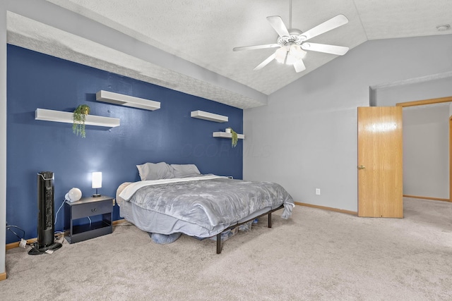 bedroom featuring lofted ceiling, carpet floors, a textured ceiling, and baseboards