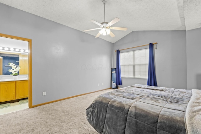 bedroom with lofted ceiling, light colored carpet, a textured ceiling, and baseboards