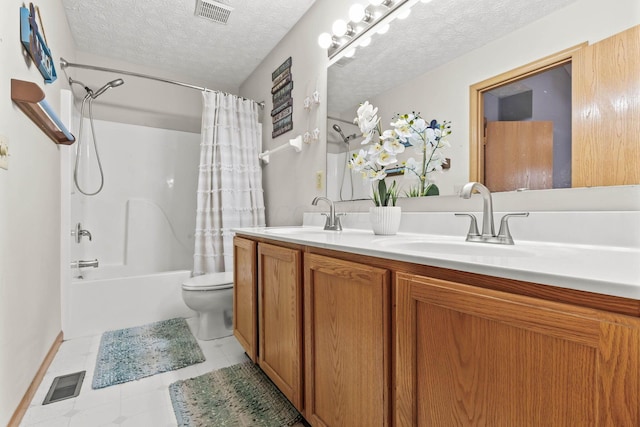 bathroom with toilet, visible vents, and a sink