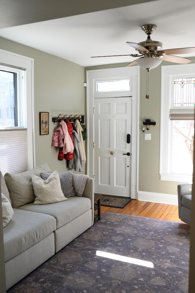 living room featuring wood finished floors and baseboards