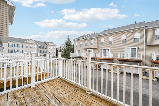 deck featuring a residential view and central AC