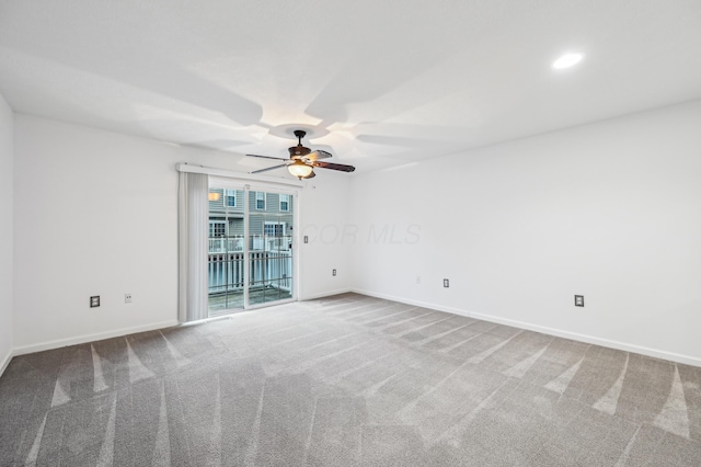 spare room featuring a ceiling fan, baseboards, carpet flooring, and recessed lighting