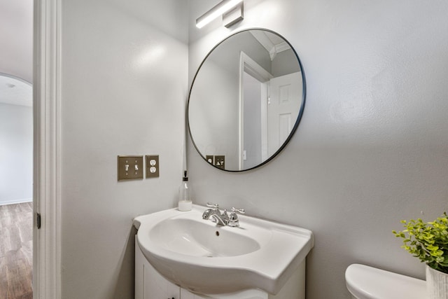 bathroom featuring toilet and wood finished floors