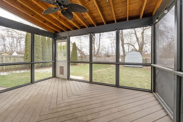 unfurnished sunroom with wooden ceiling and ceiling fan