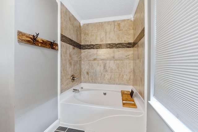 full bath featuring a tub to relax in, crown molding, and a textured ceiling