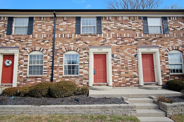 view of front of house with brick siding